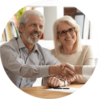 Happy senior old family couple clients make financial insurance estate business deal handshake agent lawyer, satisfied mature customers shake hand meeting bank manager agree on investment